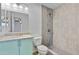 Nicely remodeled bathroom featuring tiled walk-in shower and sink with granite countertop at 2706 W Isabella Ave, Mesa, AZ 85202