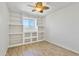 Neutral bedroom featuring built in shelves and light wood flooring at 2706 W Isabella Ave, Mesa, AZ 85202