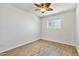 Bedroom featuring light wood flooring, ceiling fan, and a bright window at 2706 W Isabella Ave, Mesa, AZ 85202
