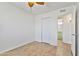 Bedroom features light wood flooring and access to the bathroom at 2706 W Isabella Ave, Mesa, AZ 85202