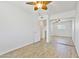 Light bedroom with closet, ceiling fan, and light wood flooring throughout at 2706 W Isabella Ave, Mesa, AZ 85202