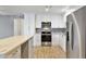 Bright kitchen featuring stainless steel appliances, ample cabinets, and an island at 2706 W Isabella Ave, Mesa, AZ 85202