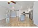 Open concept living area with views of a modern kitchen and ample natural light at 2706 W Isabella Ave, Mesa, AZ 85202
