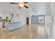 Spacious living room featuring tile flooring and a seamless transition to the kitchen at 2706 W Isabella Ave, Mesa, AZ 85202