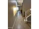 Hallway with neutral walls, tile floors and natural light at 28306 N 25Th Dl, Phoenix, AZ 85085