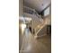 Spacious foyer featuring staircase with white railings, and open access to other living areas at 28306 N 25Th Dl, Phoenix, AZ 85085