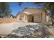 A partially shaded backyard featuring a patio area and privacy wall at 2861 E Morenci Rd, San Tan Valley, AZ 85143