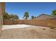 View of backyard featuring desert landscaping, a patio, privacy wall, and some trees at 2861 E Morenci Rd, San Tan Valley, AZ 85143