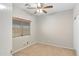 Bedroom with ceiling fan, carpeted floors, and a window at 2861 E Morenci Rd, San Tan Valley, AZ 85143