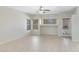 Large living room with tile flooring, ceiling fan, and windows at 2861 E Morenci Rd, San Tan Valley, AZ 85143