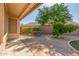 Inviting backyard patio features a seating area, mature trees, and low-maintenance gravel landscaping at 29049 N Coal Ave, San Tan Valley, AZ 85143