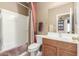 Full bathroom featuring shower/tub combo and a decorative mirror at 29049 N Coal Ave, San Tan Valley, AZ 85143
