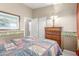 Cozy bedroom featuring neutral paint and queen size bed with patterned comforter at 29049 N Coal Ave, San Tan Valley, AZ 85143