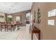 Elegant dining room with a large wooden table, stylish chairs, and decorative accents at 29049 N Coal Ave, San Tan Valley, AZ 85143