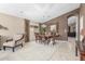 Elegant dining room with a large wooden table, stylish chairs, and decorative accents at 29049 N Coal Ave, San Tan Valley, AZ 85143
