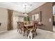 Elegant dining room with a large wooden table, stylish chairs, and decorative accents at 29049 N Coal Ave, San Tan Valley, AZ 85143