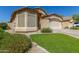 Charming single-story home featuring a two-car garage and a well-maintained landscaped front yard at 29049 N Coal Ave, San Tan Valley, AZ 85143