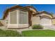 Charming single-story home featuring a two-car garage and a well-maintained landscaped front yard at 29049 N Coal Ave, San Tan Valley, AZ 85143