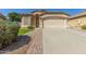 Charming single-story home featuring a two-car garage and a well-maintained landscaped front yard at 29049 N Coal Ave, San Tan Valley, AZ 85143