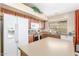 Well-equipped kitchen with an island, stainless steel oven, and a view to the window above the sink at 29049 N Coal Ave, San Tan Valley, AZ 85143