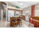 Functional kitchen features an island with seating, white appliances, and tile flooring at 29049 N Coal Ave, San Tan Valley, AZ 85143