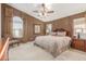 Main bedroom featuring a ceiling fan, ample natural light, and neutral-toned decor for a relaxing ambiance at 29049 N Coal Ave, San Tan Valley, AZ 85143