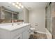 Bathroom featuring a shower, toilet and vanity with neutral paint at 3061 W Betty Elyse Ln, Phoenix, AZ 85053