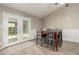 Dining room with a wooden table, chairs, and a glass door leading to the backyard at 3061 W Betty Elyse Ln, Phoenix, AZ 85053