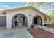 A single-Gathering home showing a front porch with chairs, manicured flowerpots, and excellent curb appeal at 3061 W Betty Elyse Ln, Phoenix, AZ 85053