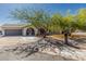 Inviting single-Gathering home boasting a large driveway, mature trees, and an appealing front yard at 3061 W Betty Elyse Ln, Phoenix, AZ 85053