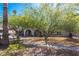 Single-Gathering home featuring an attached two-car garage and mature trees in the well-maintained front yard at 3061 W Betty Elyse Ln, Phoenix, AZ 85053