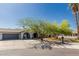 Beautiful single-Gathering home with mature trees, an attached two-car garage, and a spacious front yard at 3061 W Betty Elyse Ln, Phoenix, AZ 85053