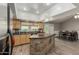 Spacious kitchen with stainless appliances, center island, and an open layout with dining area at 3061 W Betty Elyse Ln, Phoenix, AZ 85053