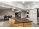Bright kitchen with a kitchen island, stainless steel appliances, and a dining area at 3061 W Betty Elyse Ln, Phoenix, AZ 85053