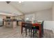 Bright kitchen featuring a dining table, stainless steel appliances, and ample cabinet space at 3061 W Betty Elyse Ln, Phoenix, AZ 85053