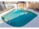 Inviting backyard swimming pool with a slide, diving board and a spacious deck at 3061 W Betty Elyse Ln, Phoenix, AZ 85053