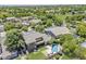 Expansive aerial view of a residential area with lush greenery, well-maintained lawns, and a community park at 3062 E Cullumber St, Gilbert, AZ 85234