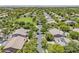High-angle view of a neighborhood with tree-lined streets and well-maintained homes, showcasing a sense of community at 3062 E Cullumber St, Gilbert, AZ 85234