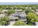 Aerial view of a home with solar panels, lush landscaping, and a view of surrounding homes and mountains at 3062 E Cullumber St, Gilbert, AZ 85234