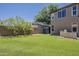 Lush backyard with mature landscaping features a built-in BBQ, providing a private retreat at 3062 E Cullumber St, Gilbert, AZ 85234