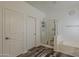 Well lit bathroom with white cabinets, glass shower stall, soaking tub and wood look floors at 3062 E Cullumber St, Gilbert, AZ 85234