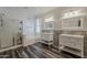 Modern bathroom featuring dual sinks, a glass enclosed shower and a separate soaking tub at 3062 E Cullumber St, Gilbert, AZ 85234