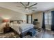 Spacious bedroom features a large bed, ensuite sitting area, and neutral colors with ample natural light at 3062 E Cullumber St, Gilbert, AZ 85234