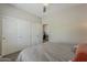 This is a bedroom with closet doors, a view into an office, and neutral tones at 3062 E Cullumber St, Gilbert, AZ 85234