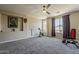 Large bonus room featuring carpet floors, a ceiling fan, natural light, and ample space for activities at 3062 E Cullumber St, Gilbert, AZ 85234