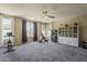 Large bonus room with neutral carpet, recessed lighting, ceiling fan, and plenty of natural light at 3062 E Cullumber St, Gilbert, AZ 85234