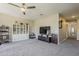 Bonus room with a ceiling fan, carpet, built-in shelving, and plenty of space to relax and enjoy at 3062 E Cullumber St, Gilbert, AZ 85234
