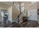 Grand foyer featuring a staircase, high ceilings, dark wood floors, and natural light at 3062 E Cullumber St, Gilbert, AZ 85234
