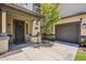 Charming front porch featuring a decorative door, covered entry, mature tree, and an attached two-car garage at 3062 E Cullumber St, Gilbert, AZ 85234