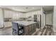 Bright kitchen featuring white cabinets, stainless steel appliances, a center island, and modern finishes at 3062 E Cullumber St, Gilbert, AZ 85234